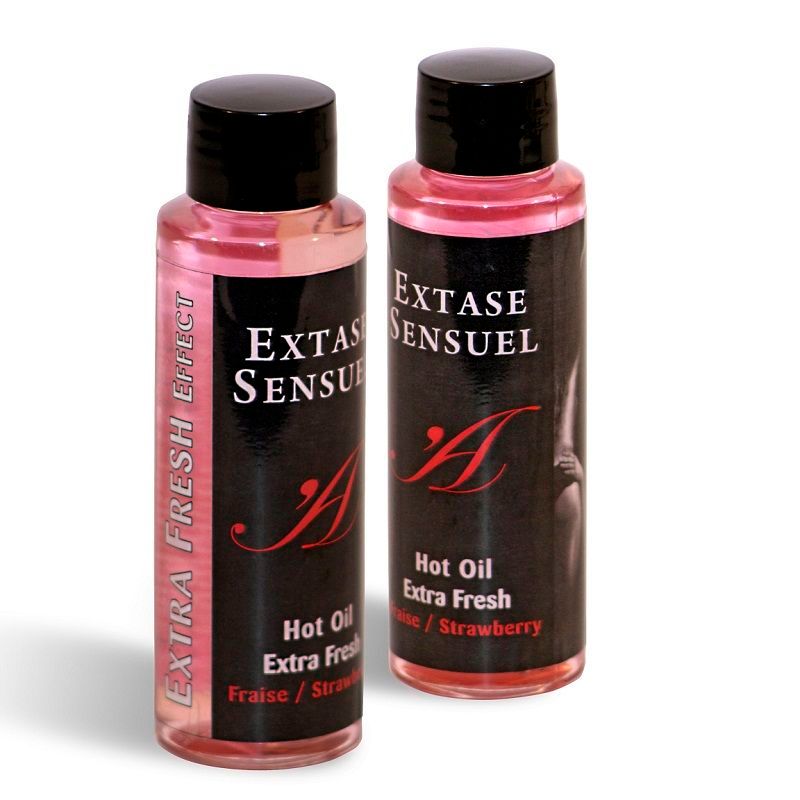 Due flaconi di Extase Sensuel Hot Oil Extra Fresh Fragola.