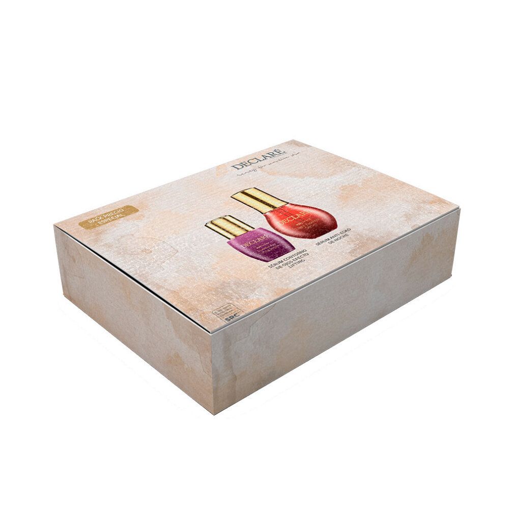Confezione regalo con due flaconi. Stampa con immagini di prodotti e scritta DECLARE.