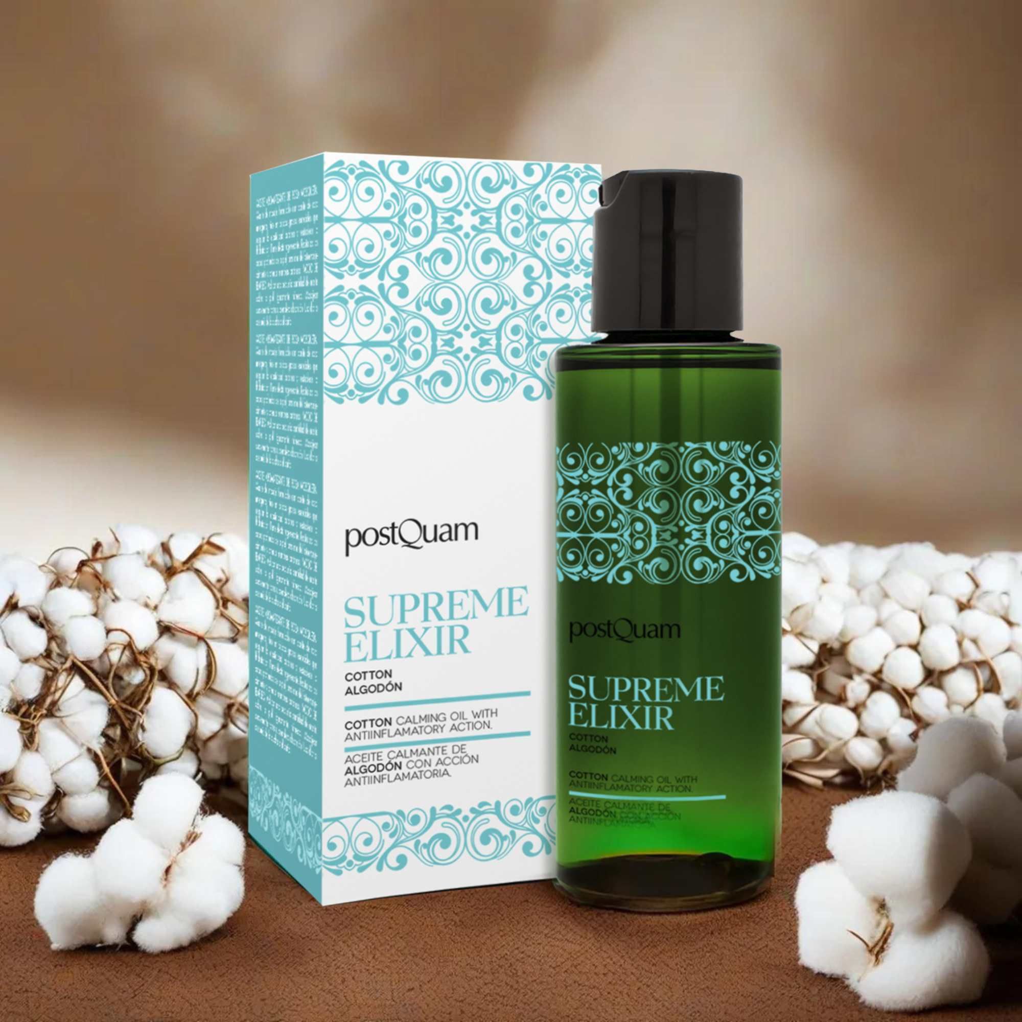 Flacone verde con tappo nero e confezione. Fiori di cotone. Scritta 'Supreme Elixir' e 'Cotton'.