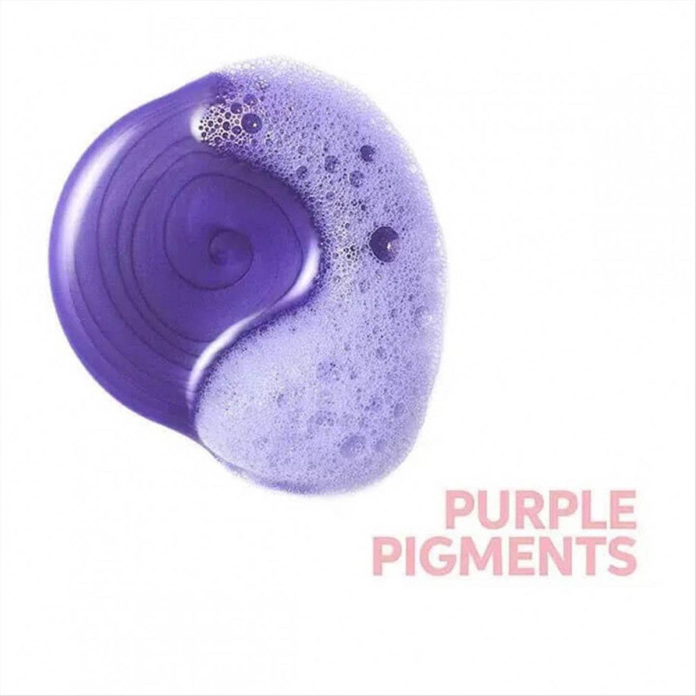 Macchia circolare di shampoo viola con schiuma. Testo: Purple Pigments.
