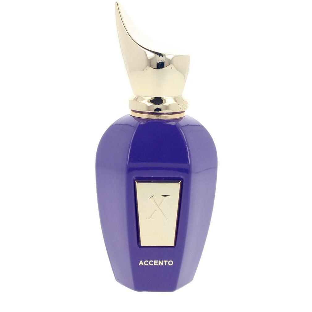 Flacone di profumo blu-viola con tappo dorato. Logo X dorato e scritta ACCENTO sul davanti.