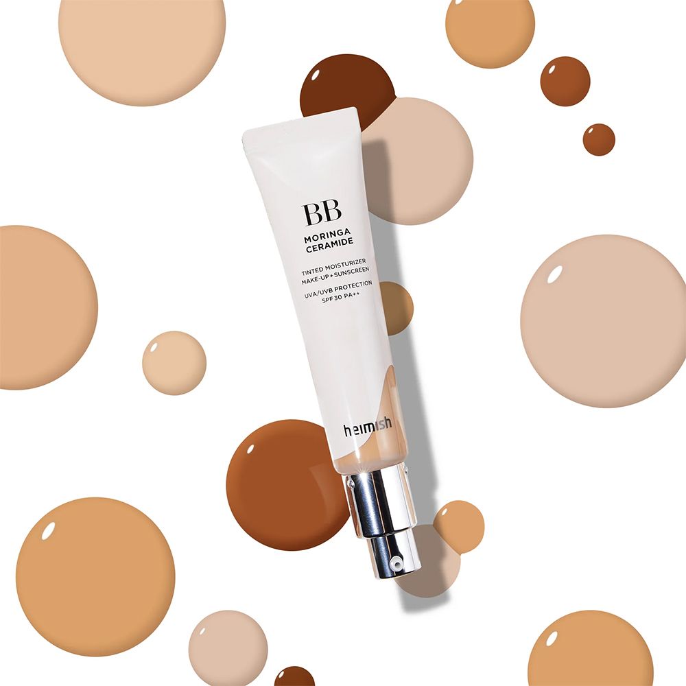 BB cream BB Moringa Ceramide circondata da gocce di colore in varie tonalità.