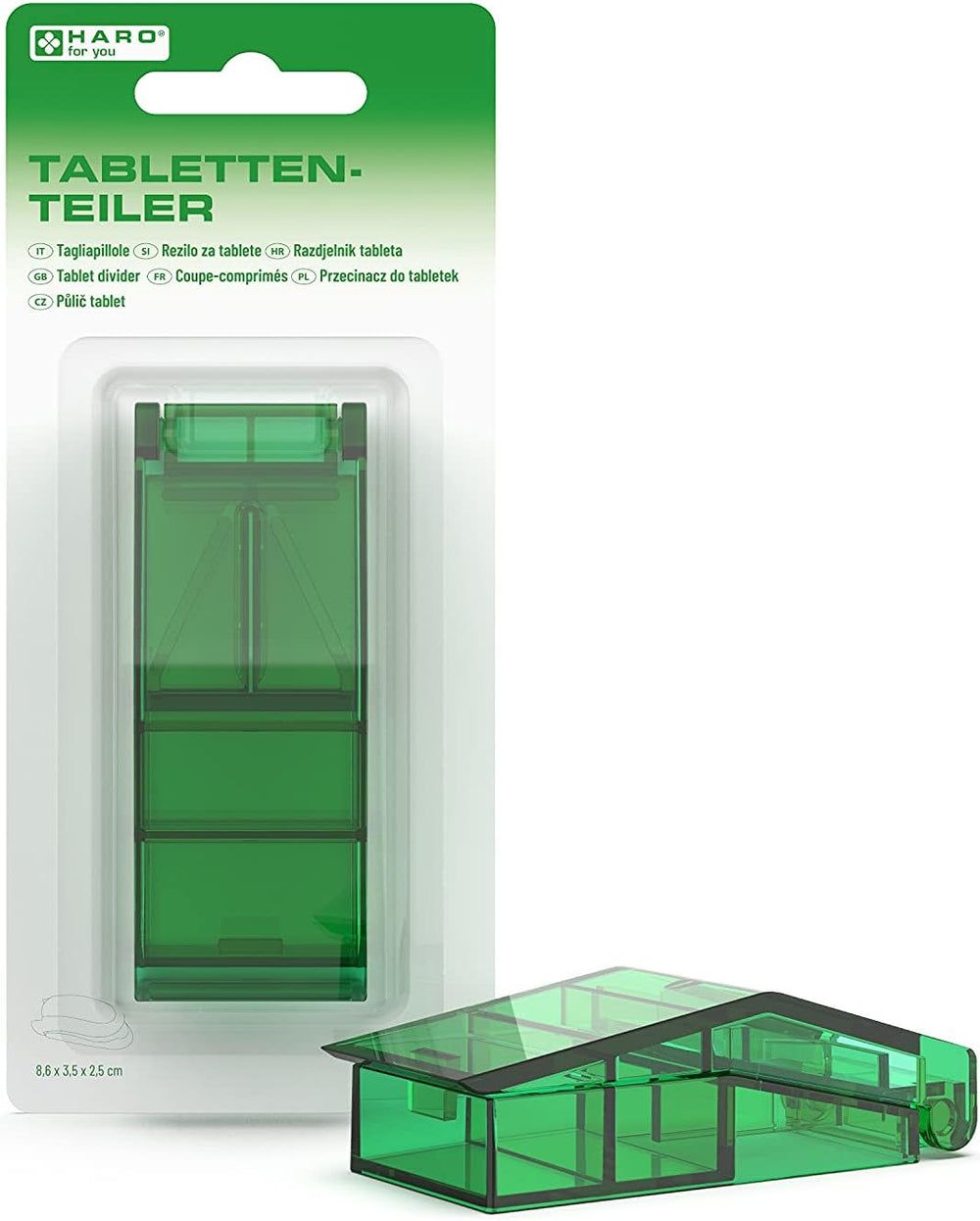 Tagliapillole verde, chiuso e aperto. Logo Haro e nome del prodotto sulla confezione.