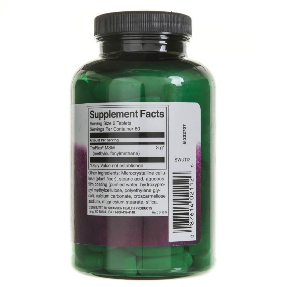 Flacone verde con integratori alimentari ed etichetta con fatti nutrizionali.