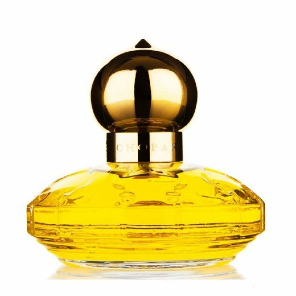 Flacone di profumo giallo con tappo dorato. Scritta: Chopard.