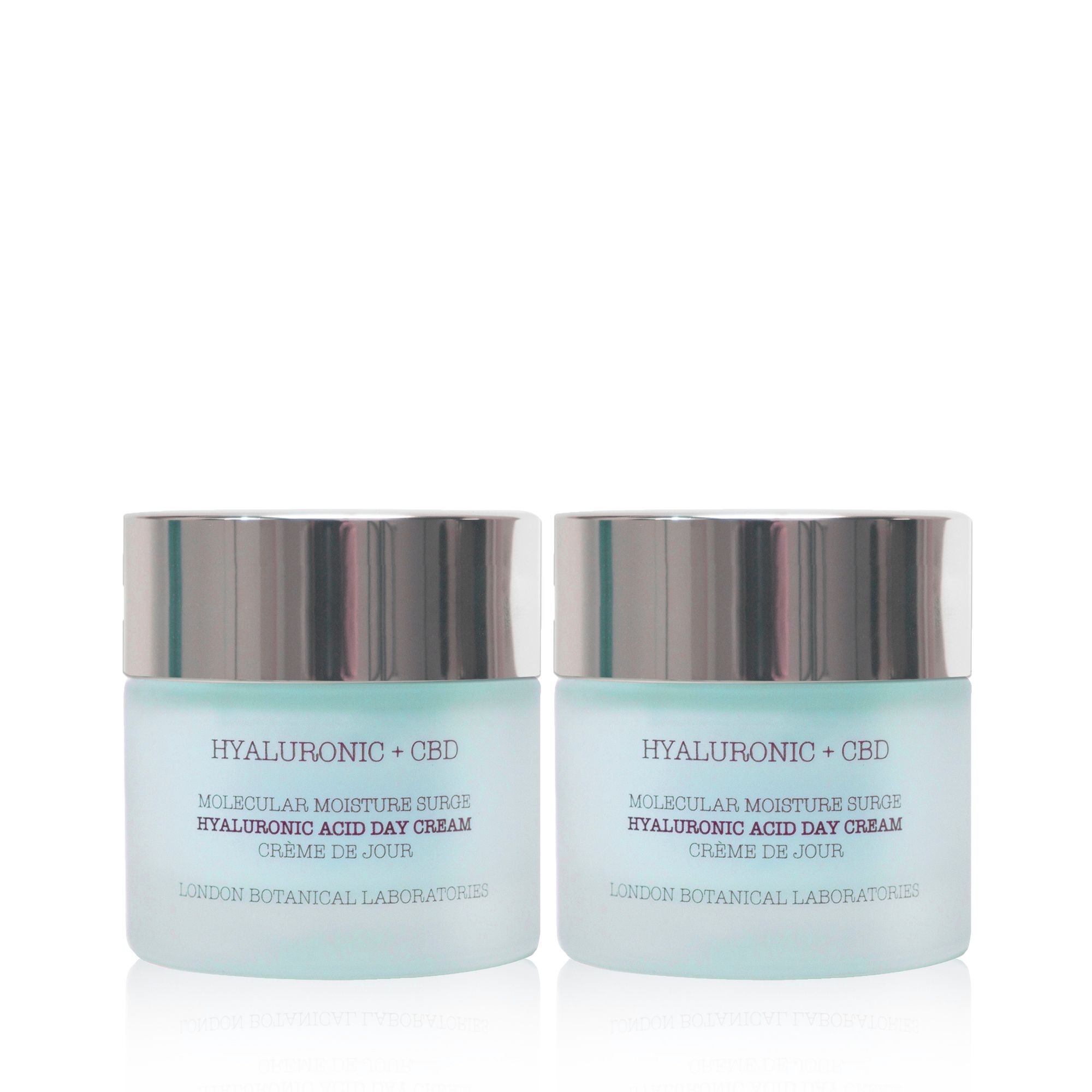 Due vasetti di crema giorno con coperchi argentati. Scritta: Hyaluronic + CBD, Molecular Moisture Surge, Crème de Jour. London Botanical Laboratories.