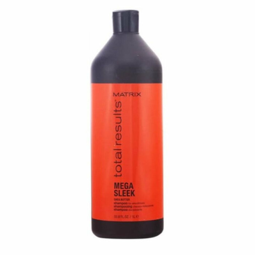 Flacone nero con etichetta rossa. Scritta: Matrix Total Results Mega Sleek Shea Butter Shampoo. 33.8 fl.oz/1L.