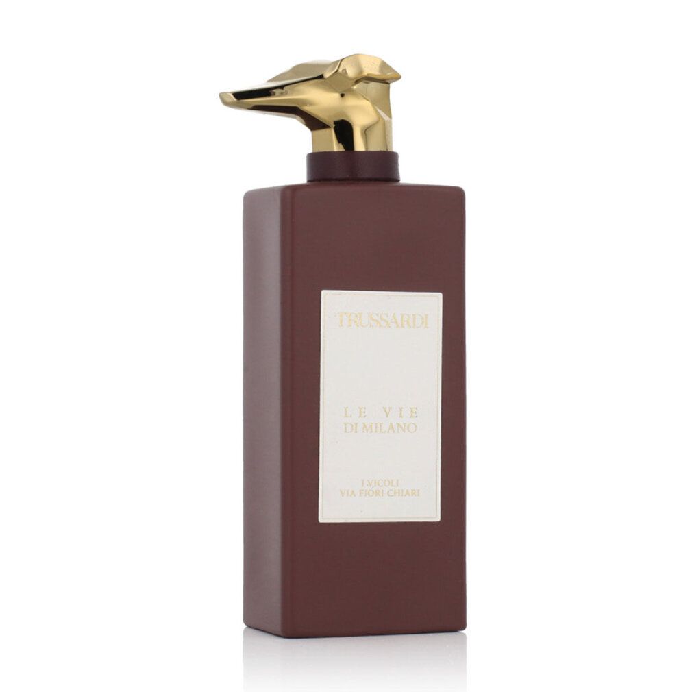 Flacone Trussardi Le Vie Di Milano Eau de Parfum. Bottiglia marrone con spruzzatore dorato ed etichetta bianca.