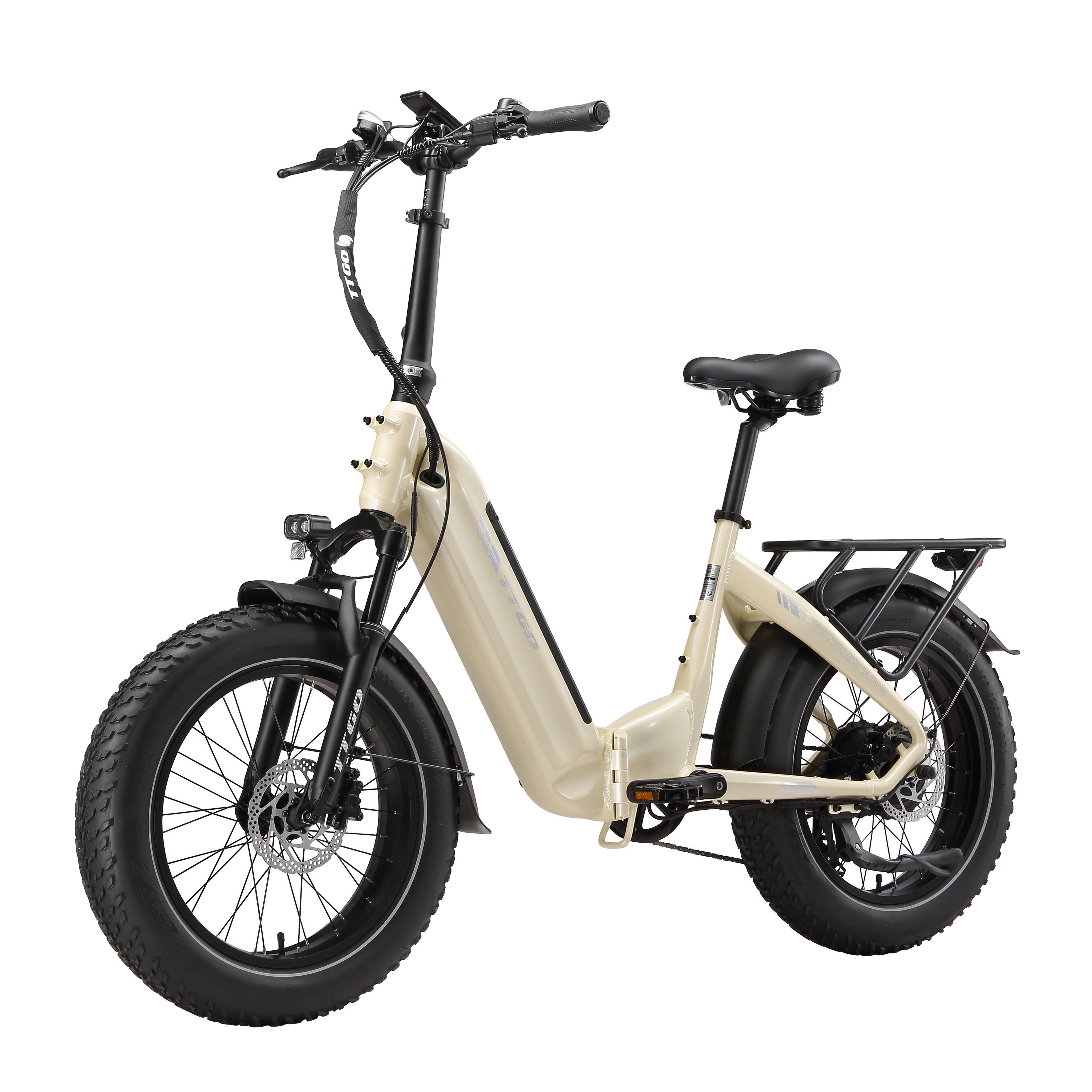 E-bike pieghevole beige con pneumatici neri. Sella nera, portapacchi. Scritta "ADVENTURE" sullo pneumatico.