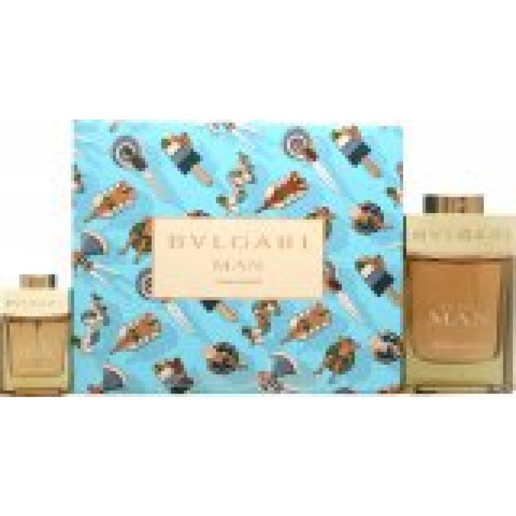 Set regalo con due flaconi di profumo. Flaconi rettangolari con liquido marrone chiaro. Confezione con motivo estivo e testo.