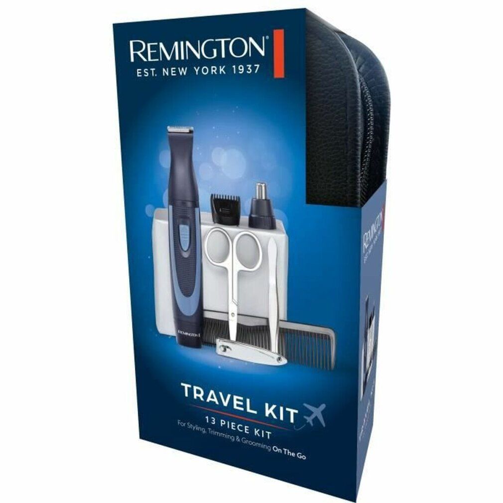 Set da viaggio Remington in confezione. Include trimmer, accessori, forbici, pettine, pinzette. Custodia nera. Testo: TRAVEL KIT.