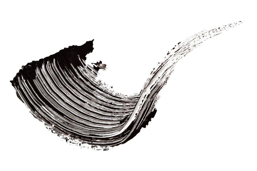 Tratto di mascara nero su sfondo bianco. Texture con motivo a setole.