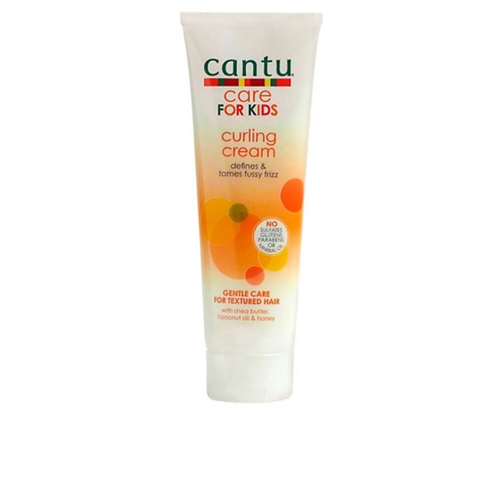 Tubo di crema arricciante Cantu Care For Kids. Bianco, con grafica e testo colorati. Contiene burro di karité, olio di cocco e miele.