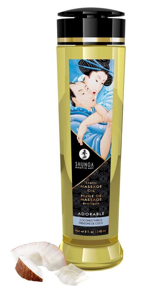 Flacone di olio da massaggio Shunga con tappo nero, etichetta e pezzi di cocco.