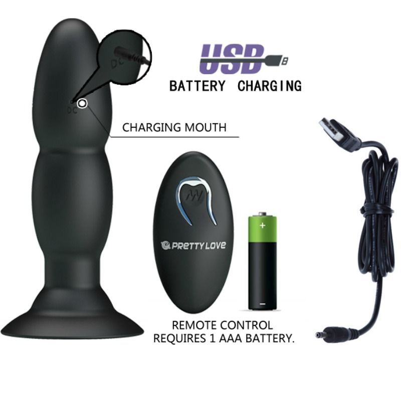 Vibratore plug nero, telecomando, batteria e cavo di ricarica. Scritta: USB Battery Charging.