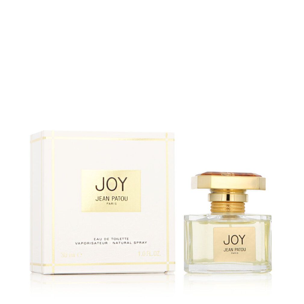 Flacone di profumo e confezione. Flacone con tappo dorato ed etichetta "JOY JEAN PATOU PARIS". Confezione con logo.