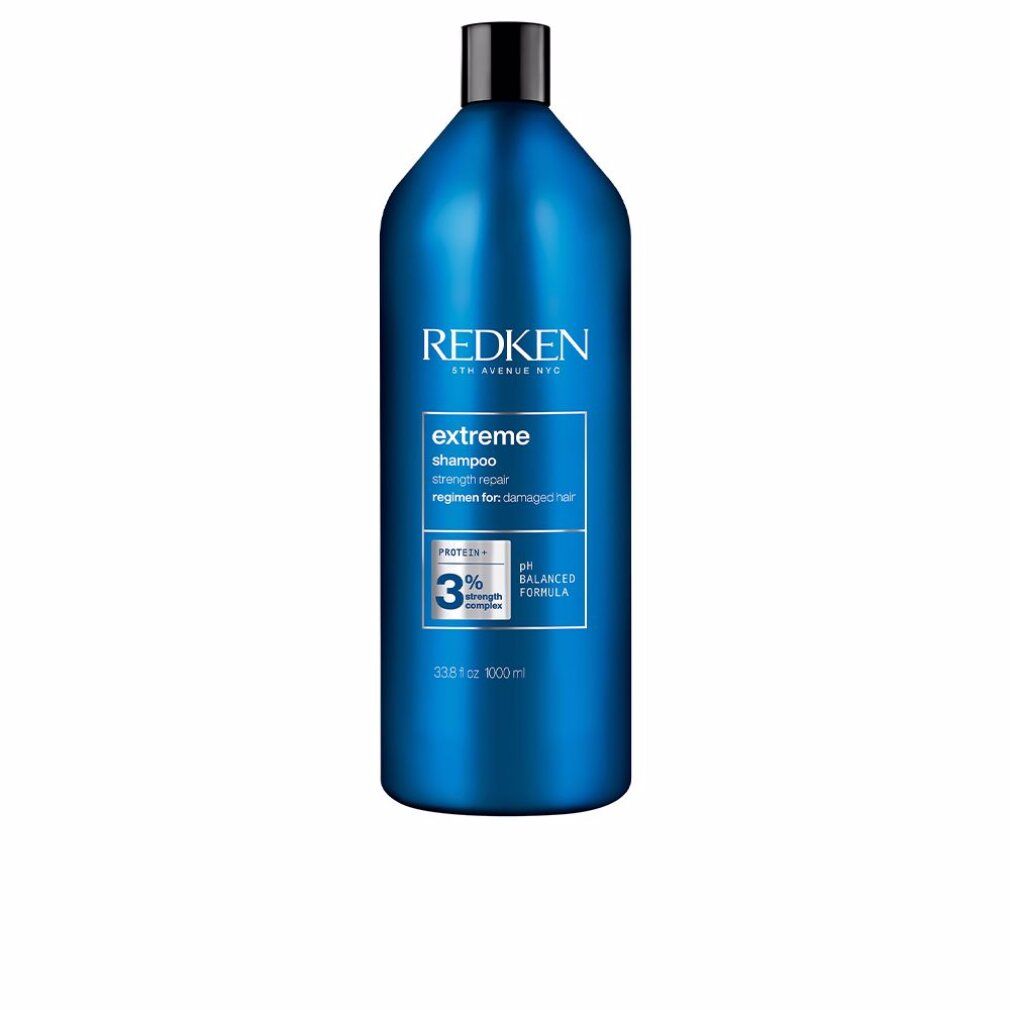 Flacone blu Redken Extreme Shampoo. Tappo nero. Testo: Extreme Shampoo, formula pH bilanciata, 1000 ml.