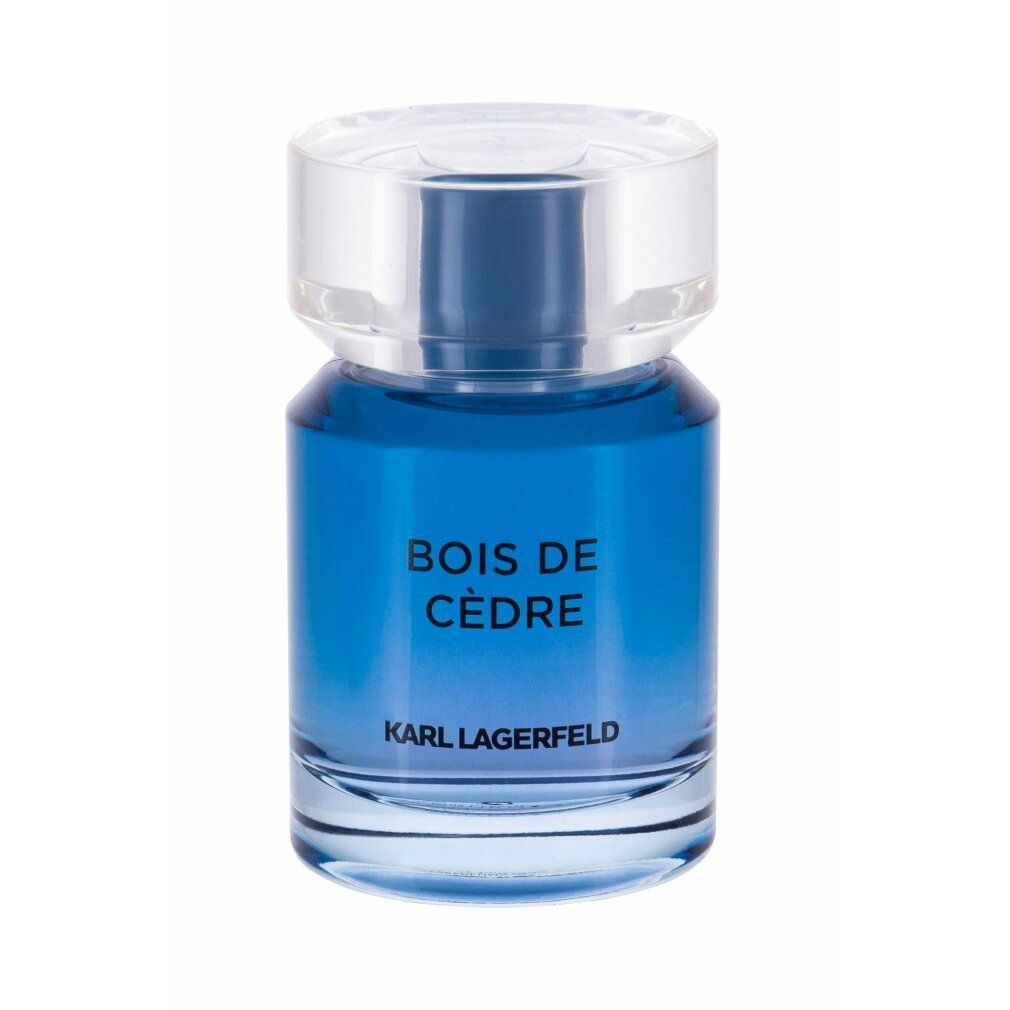 Flacone di profumo blu con tappo trasparente. Scritta: BOIS DE CÈDRE e KARL LAGERFELD.