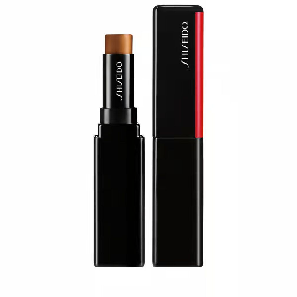 Correttore Shiseido Synchro Skin Gelstick. Stick nero con correttore marrone. Accento rosso. Marchio Shiseido.