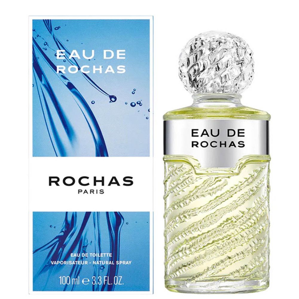 Flacone di profumo con tappo ed etichetta argentati. Scritta: Eau de Rochas. Confezione blu con nome e logo del prodotto.