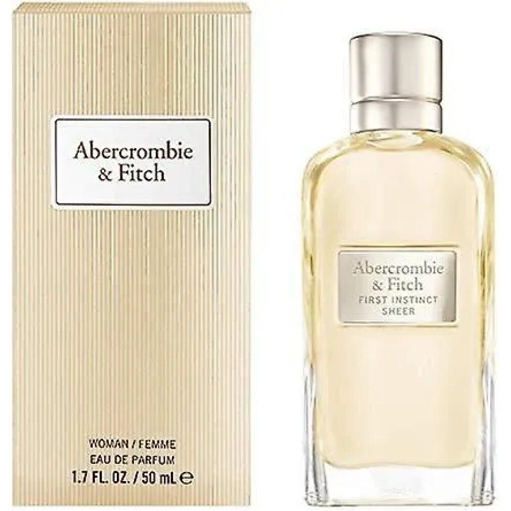 Flacone di profumo e confezione. Flacone con nome del prodotto. Confezione con nome del prodotto e testo: WOMAN/FEMME, 1.7 FL. OZ. / 50 ml e.