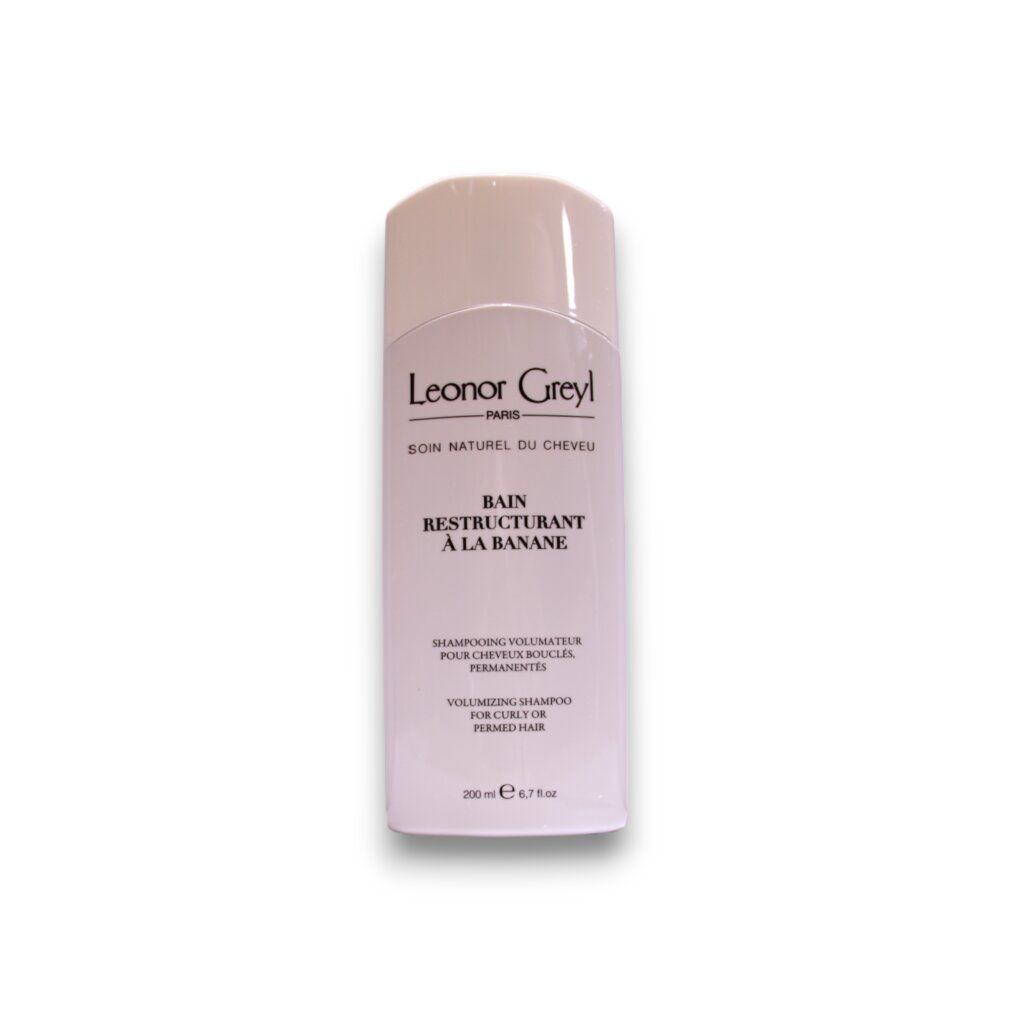 Shampoo bianco. Scritta: Leonor Greyl, Bain Restructurant à la Banane. Volume: 200 ml.