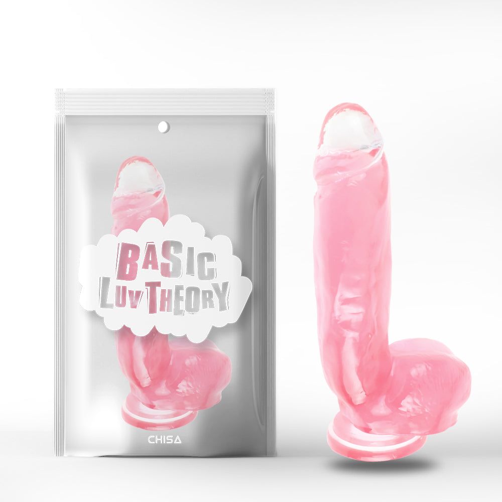 Dildo rosa accanto alla confezione. Confezione con scritta 'BASIC LUV THEORY' e 'CHISA'.