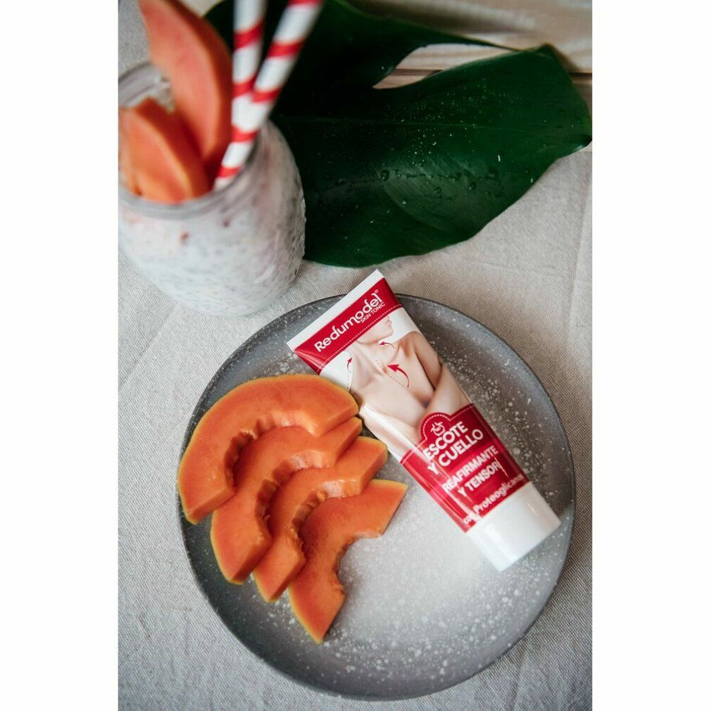 Tubo di crema Redumodel su un piatto con pezzi di papaya. Scritta: Escote y Cuello, Reafirmante y Tensor.