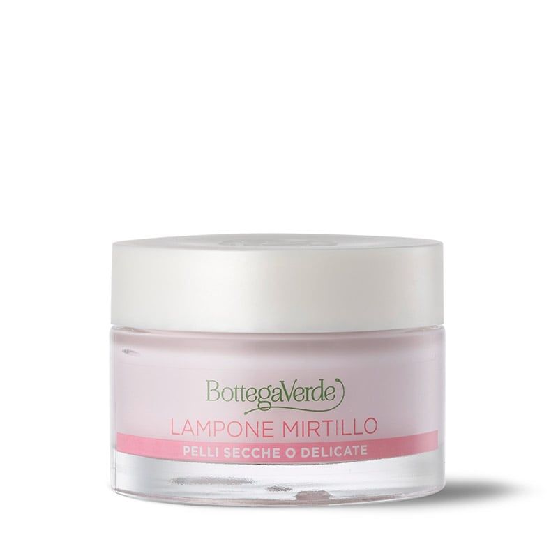 Vasetto di crema con coperchio. Scritta: Bottega Verde, Lampone Mirtillo, Pelli Secche O Delicate. Crema rosa visibile.
