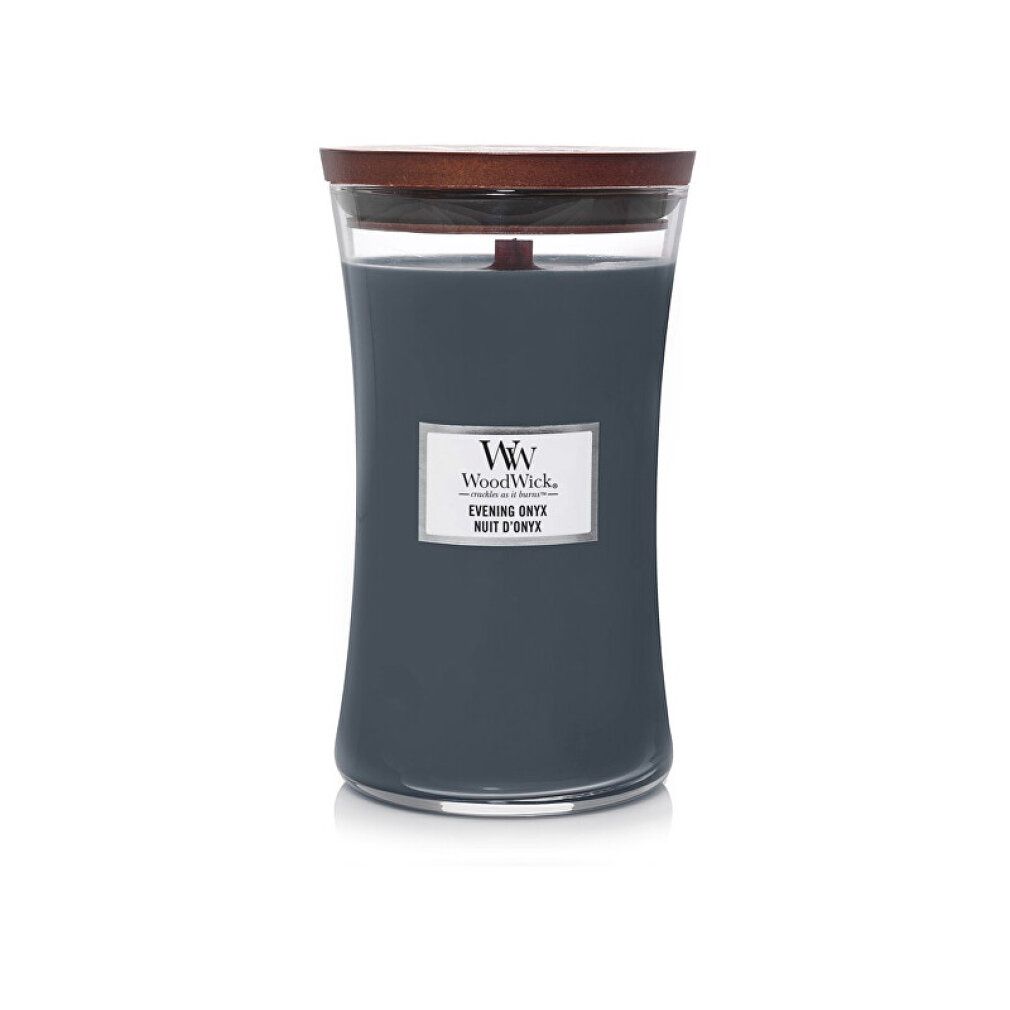 Candela Evening Onyx WoodWick con coperchio in legno. Contenitore in vetro curvo. Etichetta bianca con testo.