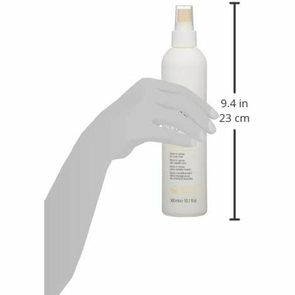 Flacone bianco con vaporizzatore, tenuto da una mano. Scritta: Milk Shake, Curl Passion Leave In. Misure: 9,4 pollici / 23 cm.