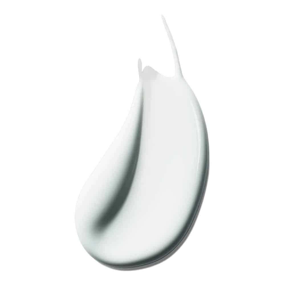 Macchia di crema bianca. Texture liscia, leggermente lucida.