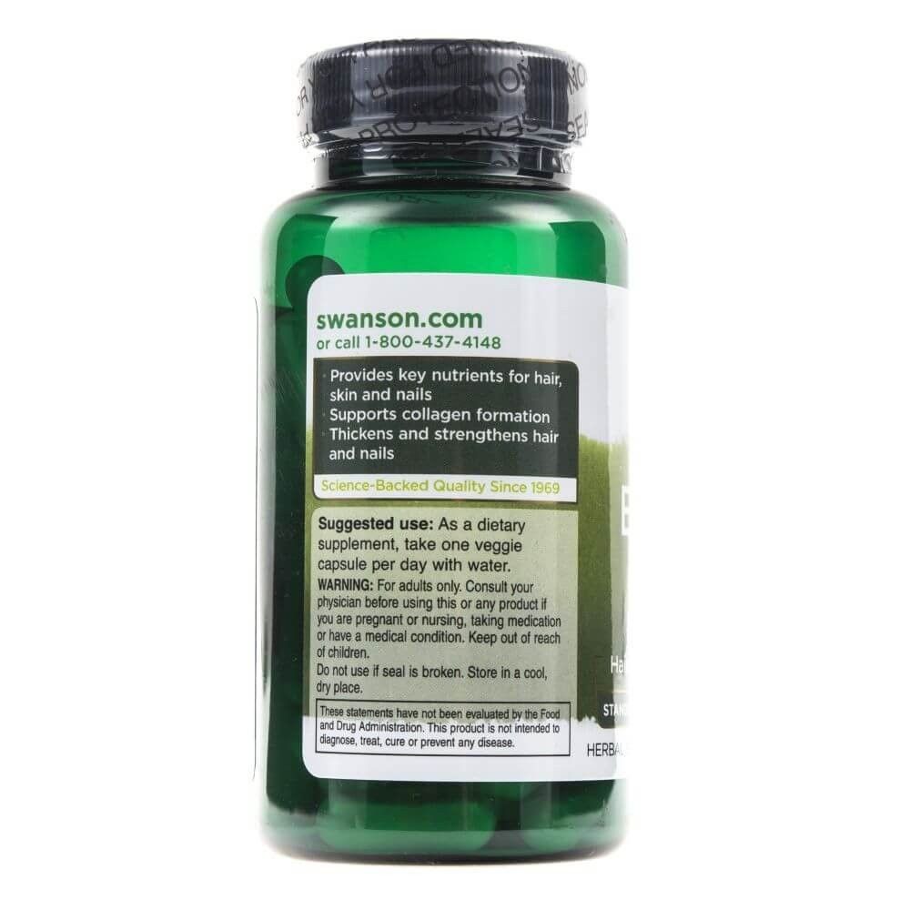 Flacone verde Swanson con etichetta che elenca i nutrienti per capelli, pelle e unghie.
