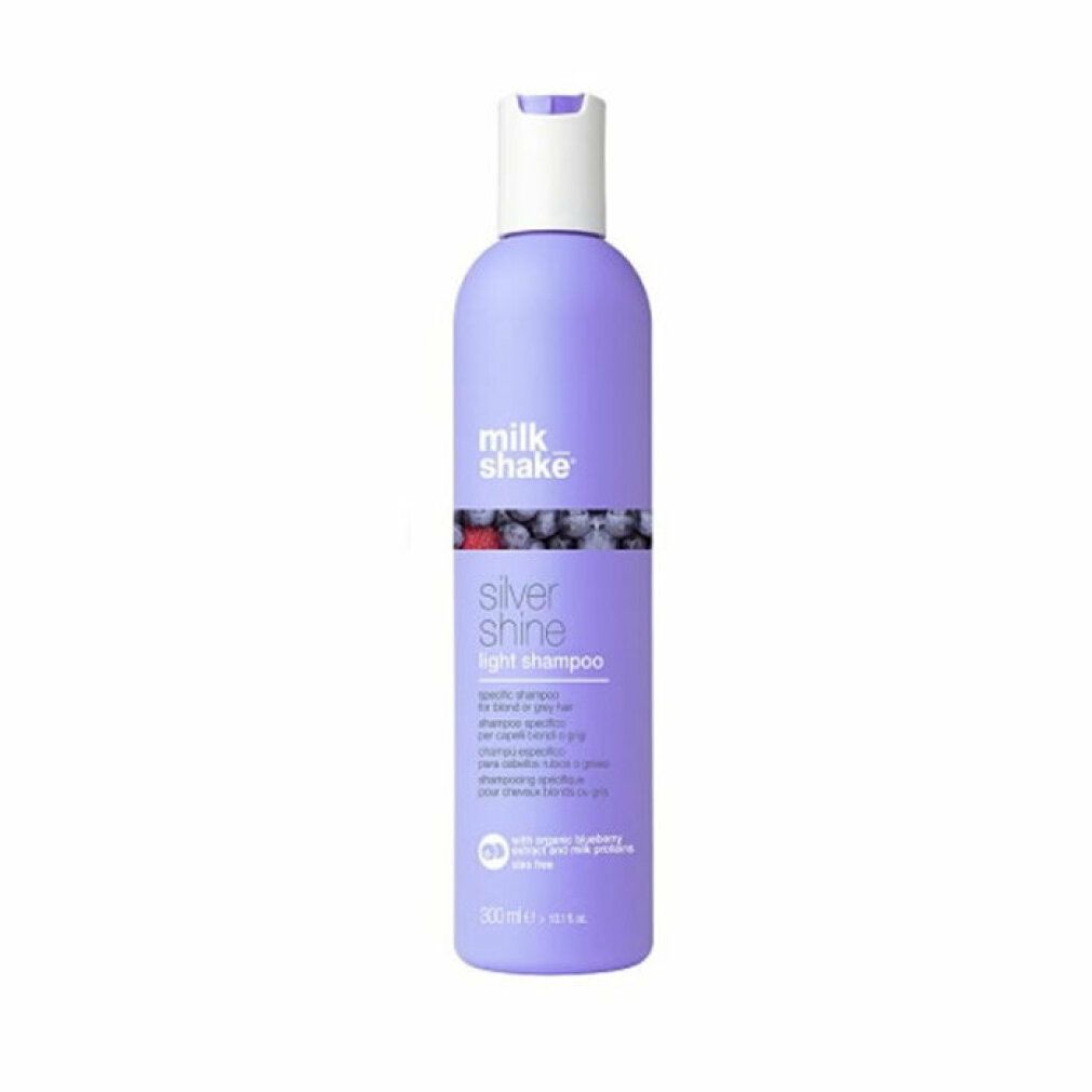 Flacone di shampoo viola, tappo bianco. Scritta: milk_shake, Silver Shine light shampoo. Con mirtillo e proteine del latte.