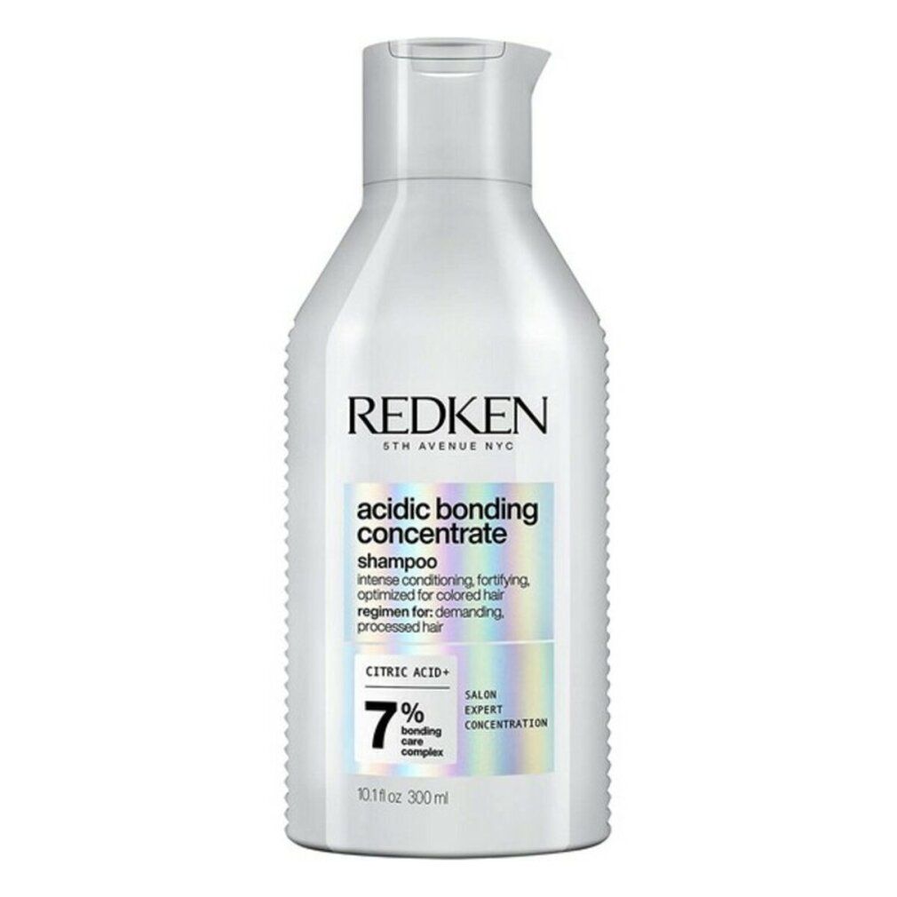 Flacone di shampoo bianco. Scritte: REDKEN, acidic bonding concentrate shampoo, 7% bonding care complex. 300 ml.