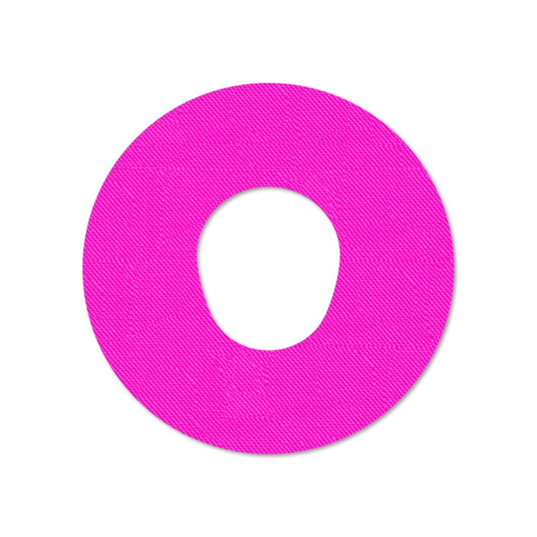 Cerotto di fissaggio rosa con foro centrale. Forma rotonda, superficie strutturata.