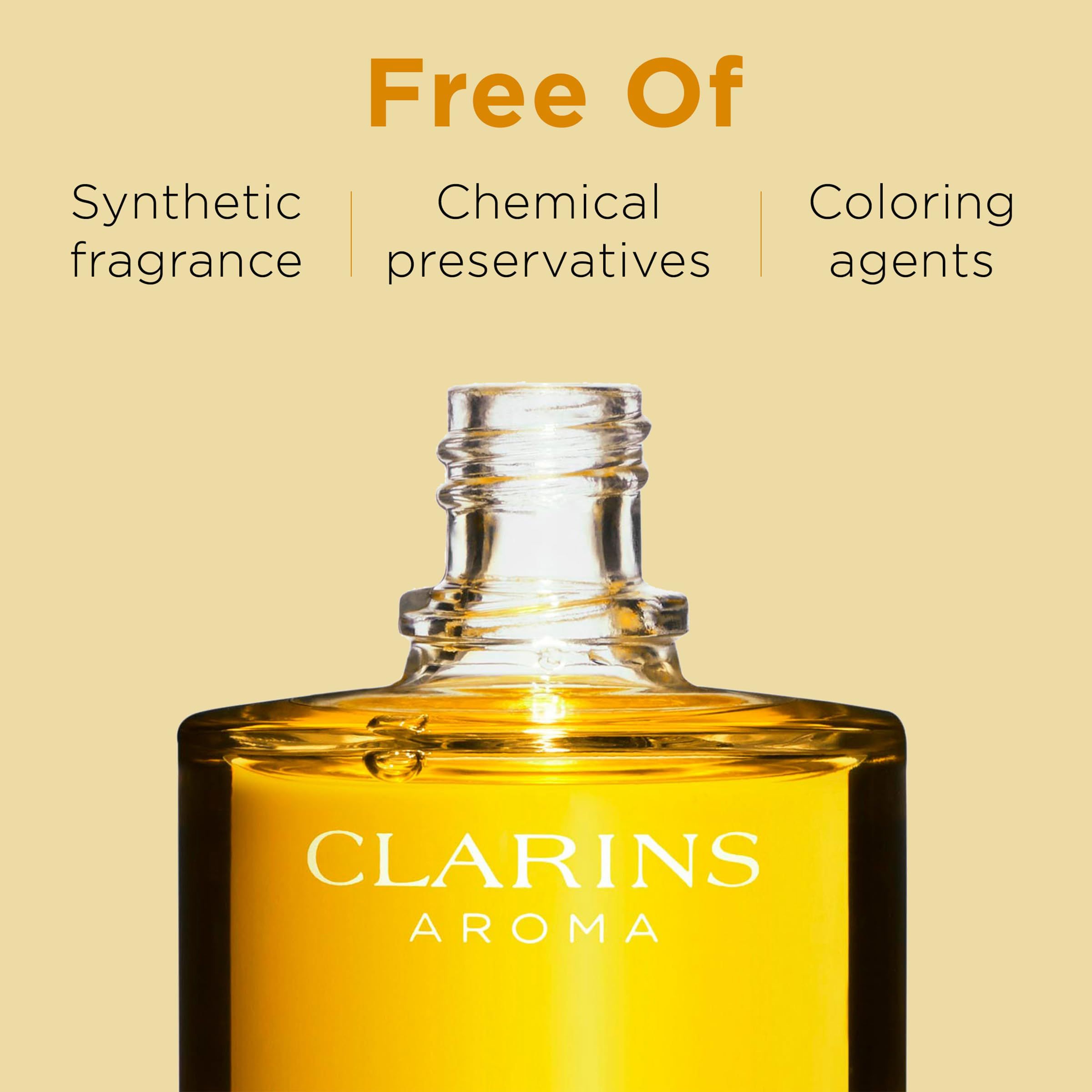 Flacone Clarins Aroma con testo: Free Of Synthetic fragrance, Chemical preservatives, Coloring agents.