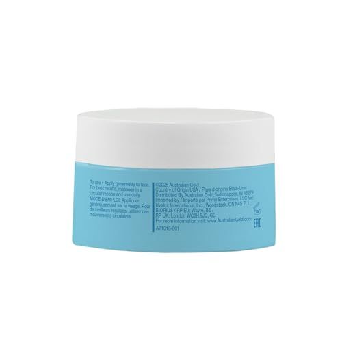 Retro del barattolo di crema viso blu e bianco. Testo: istruzioni per l'uso, ingredienti, informazioni sul produttore. Marchio: Australian Gold.