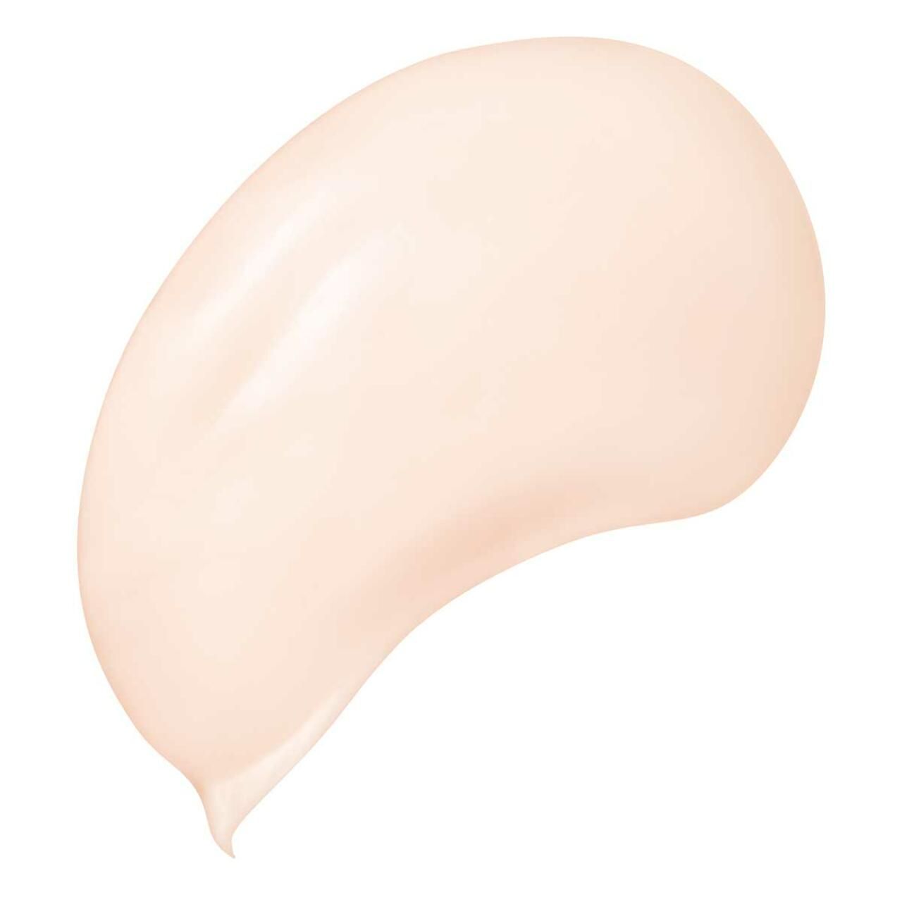 Macchia di crema chiara. Texture liscia, forma arrotondata con estremità appuntita.