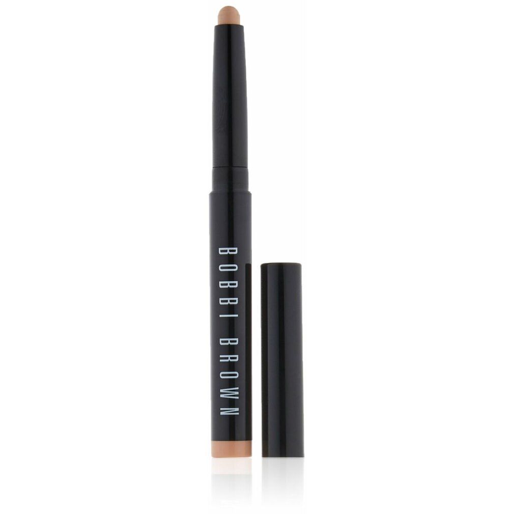 Stick nero Bobbi Brown con cappuccio aperto. Prodotto color vaniglia. Scritta: BOBBI BROWN.