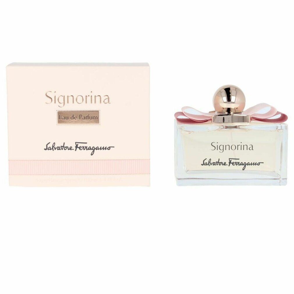 Flacone di profumo Signorina Eau de Parfum. Flacone rettangolare in vetro con liquido rosa. Fiocco rosa e tappo dorato. Scatola accanto.