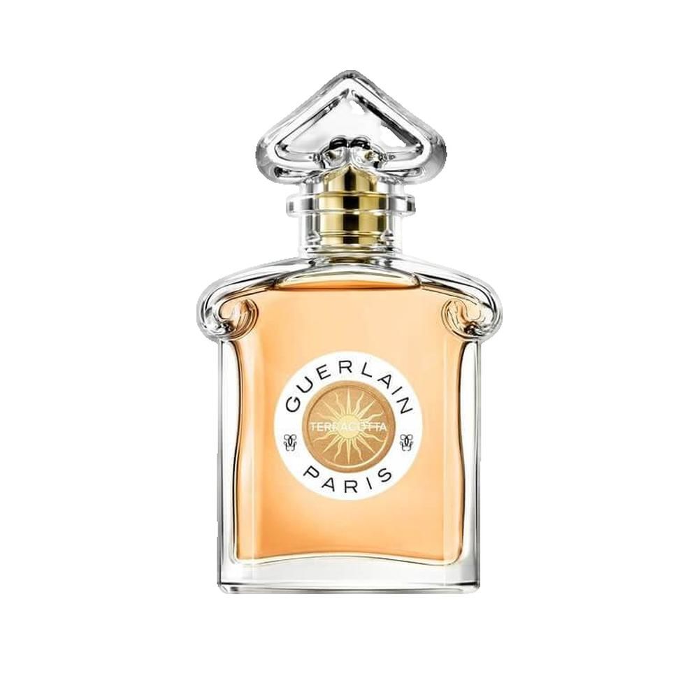 Flacone in vetro con tappo dorato. L'etichetta riporta "GUERLAIN PARIS" e "TERRACOTTA". Il flacone contiene un liquido arancione.