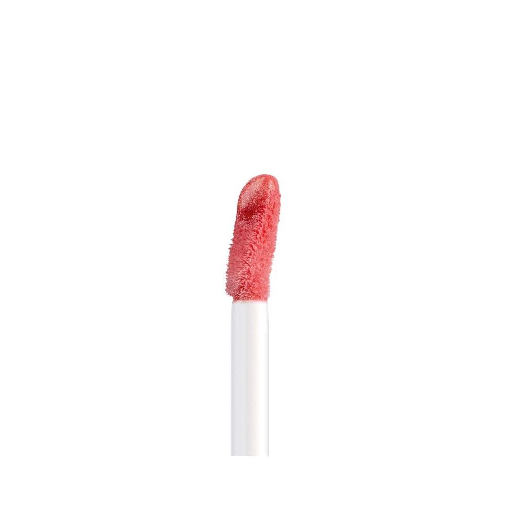 Applicatore dell'Artdeco Plumping Lip Fluid con prodotto color corallo.