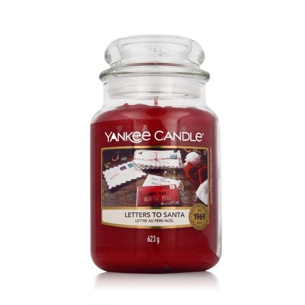 Candela profumata rossa in vaso con coperchio. Etichetta "Letters To Santa". Marchio Yankee Candle. 623g.