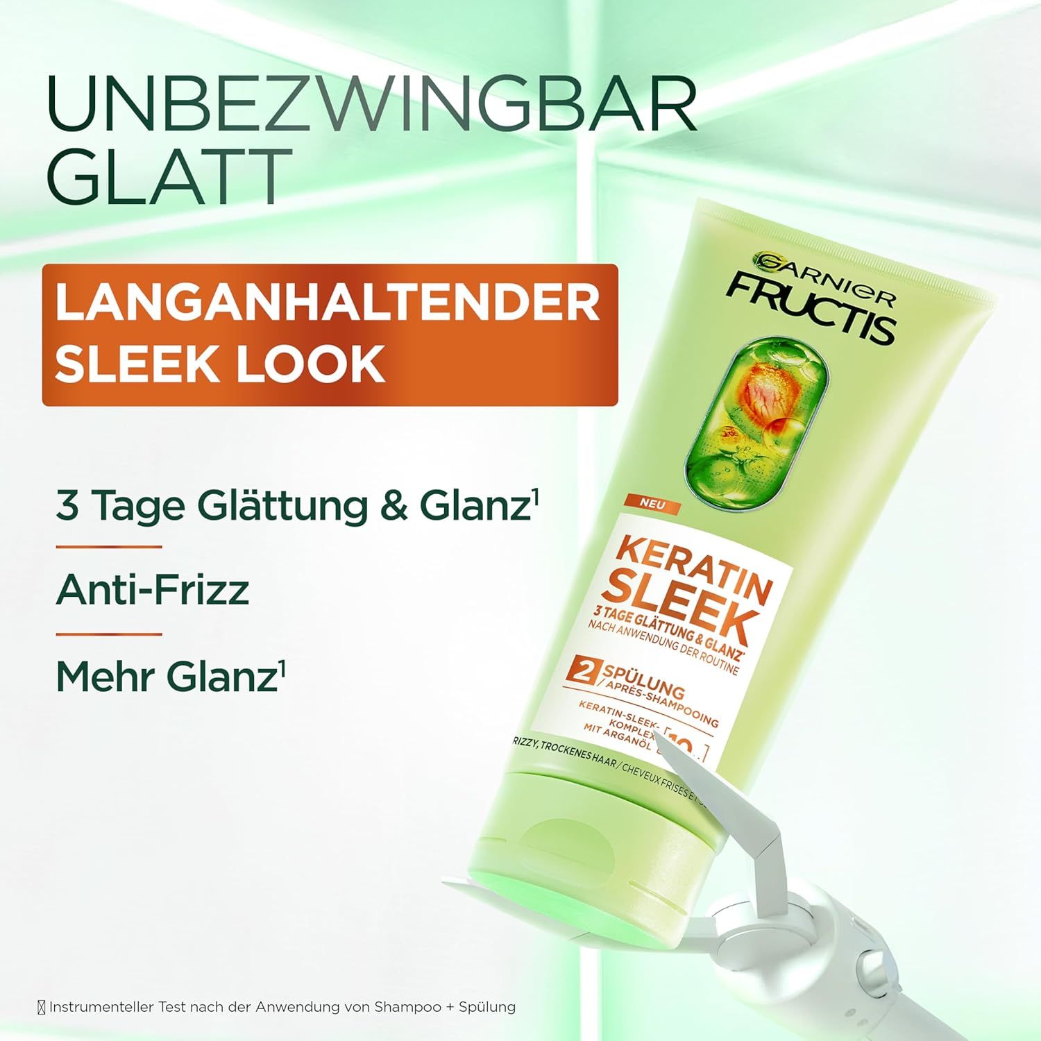Garnier Fructis Keratin Sleek Balsamo. Tubo verde con etichetta arancione. Testo: 3 giorni di liscio & lucentezza, anti-crespo.