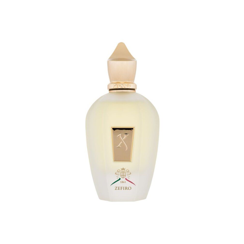 Flacone di profumo giallo con tappo dorato ed etichetta quadrata 'X'. Sotto 'ZEFIRO' e bandiera italiana.
