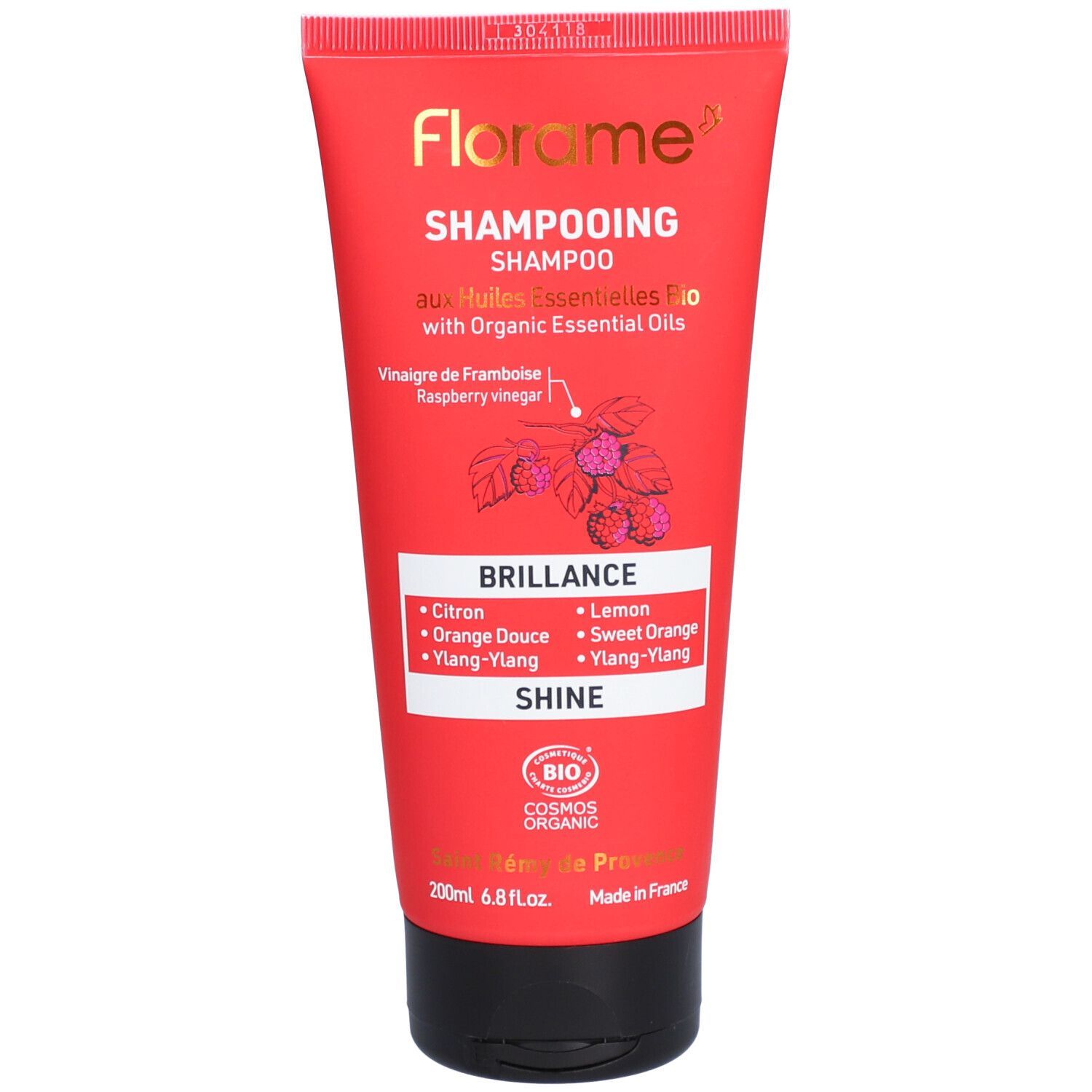 Tubo rosso Florame Shampoo. Testo: "Shampooing", "Brillance", "Huiles Essentielles Bio".