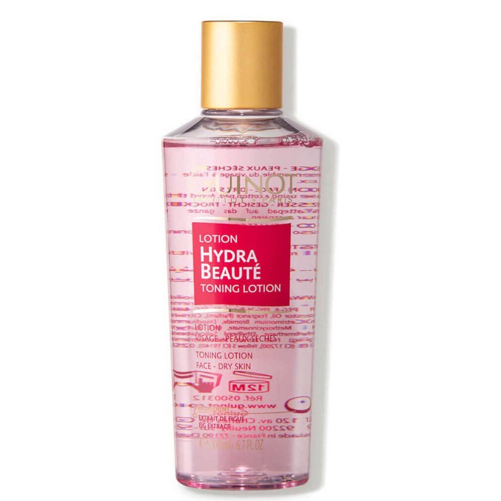 Lozione tonica Guinot Hydra Beauté. Liquido rosa in flacone, tappo dorato. Etichetta rossa con testo.