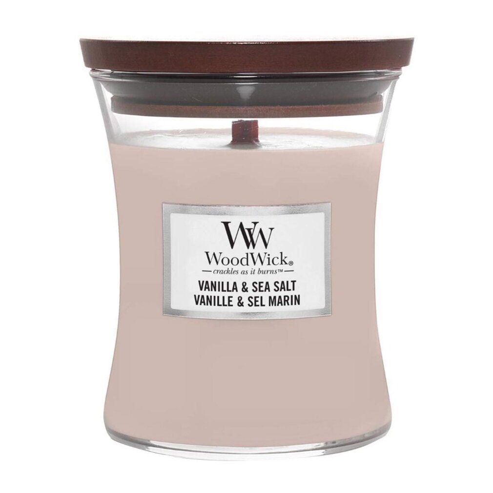 Candela a clessidra con coperchio. Etichetta "WoodWick Vanilla & Sea Salt".