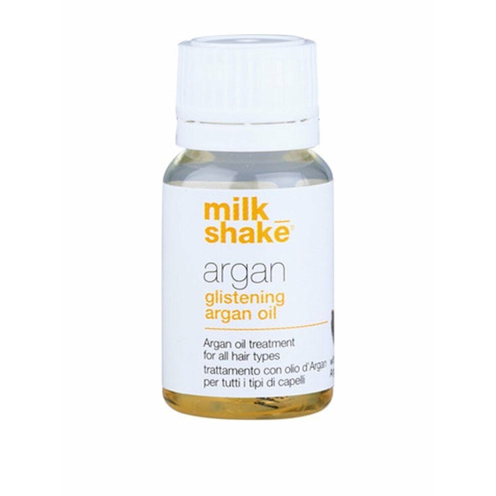 Flacone di vetro trasparente con tappo bianco. Etichetta con scritta: Milk_shake, Argan Glistening Argan Oil.